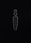 An elegant pendant catching the light against a dark, textured background.
