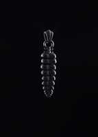 Chrome heart pendant hovering gently, edges reflecting deep etched highlights in space