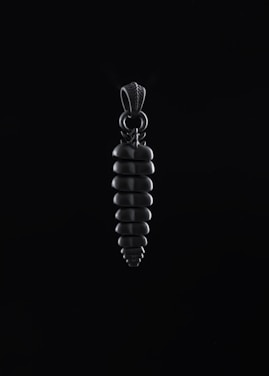 Close-up of a sleek Atalaia pendant glowing softly against a deep blue-black background.