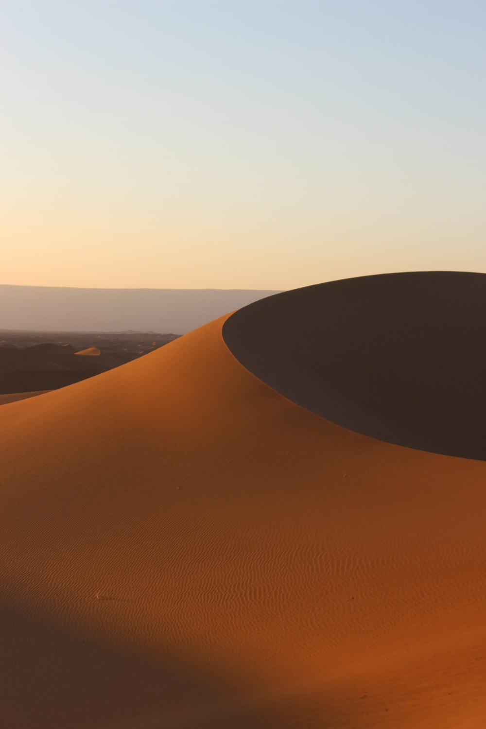 a person riding a horse in the desert