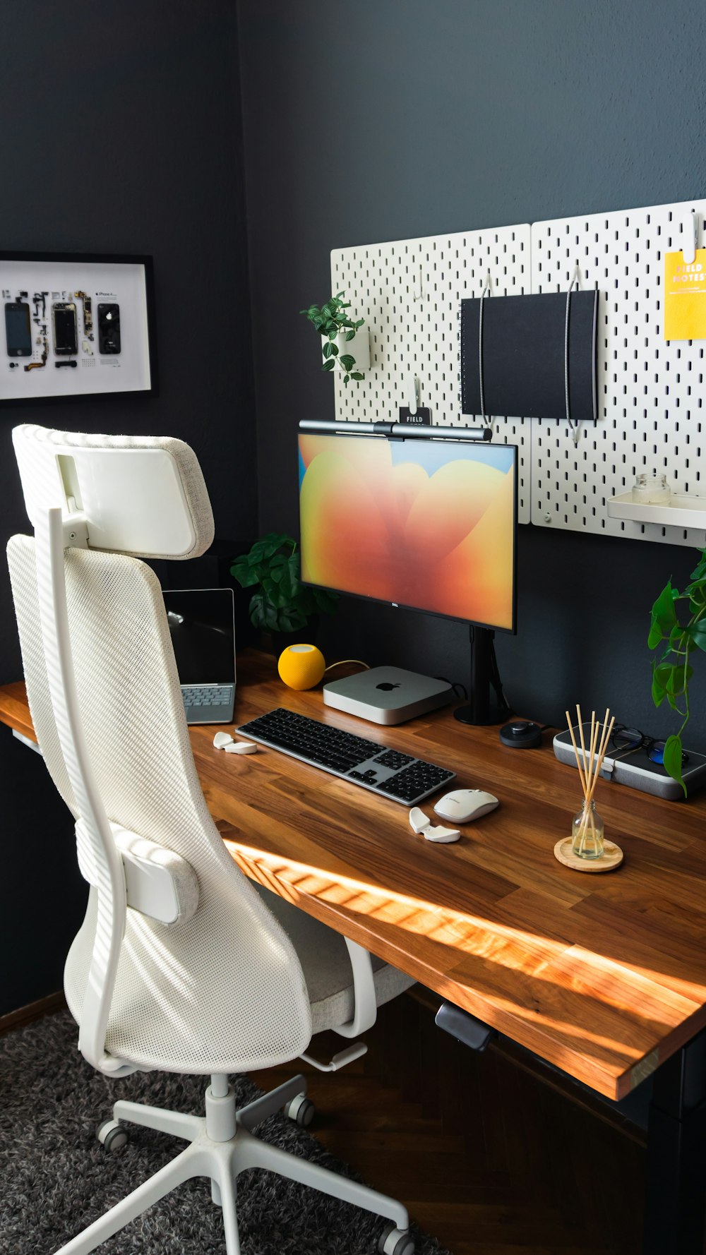 a desk with a computer monitor and keyboard on it