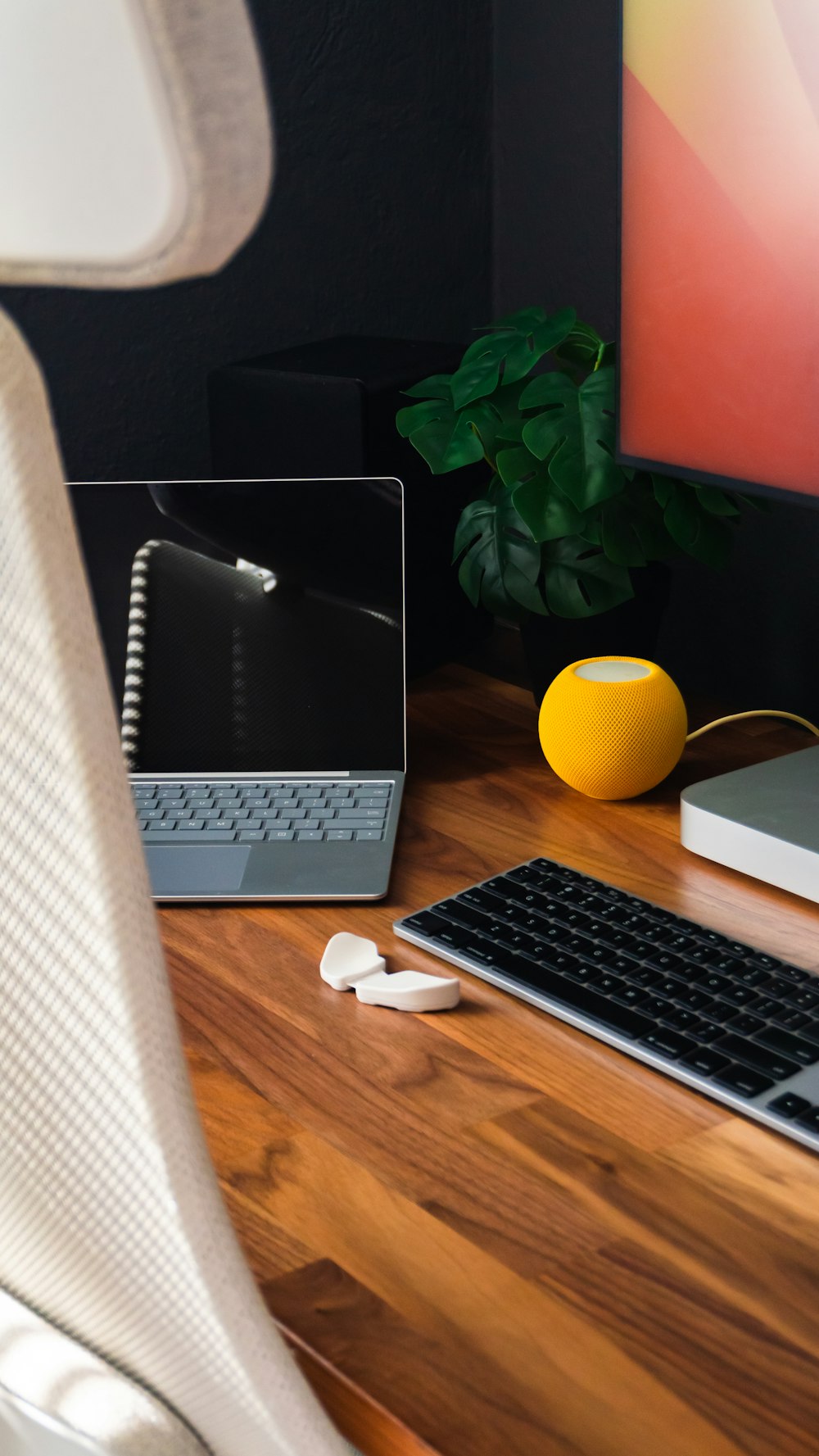 a desk with a keyboard, mouse and a monitor