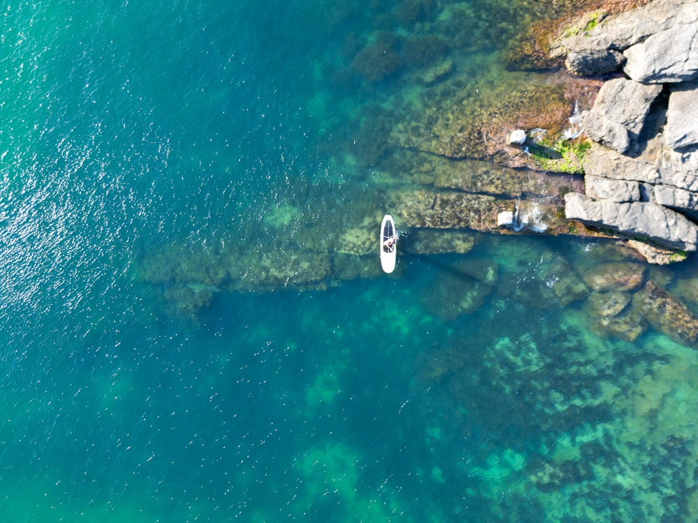 an aerial view of a boat in the water