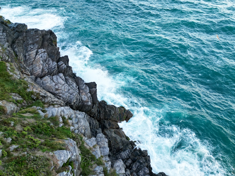 a view of the ocean from the top of a cliff