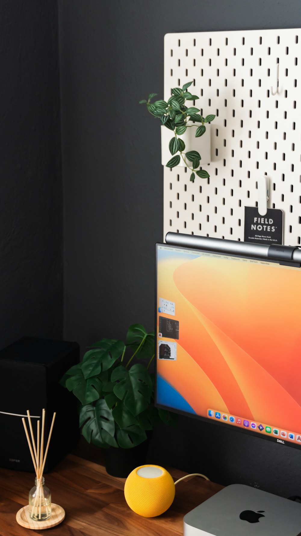 a desktop computer sitting on top of a wooden desk