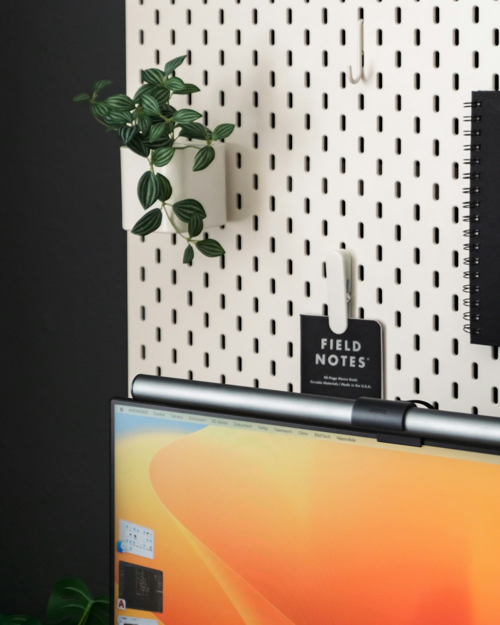 a laptop computer sitting on top of a desk