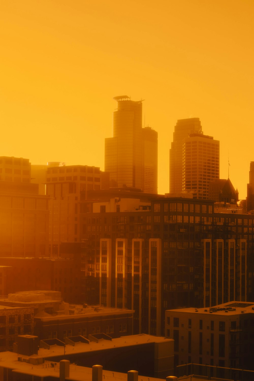 a view of a city skyline at sunset