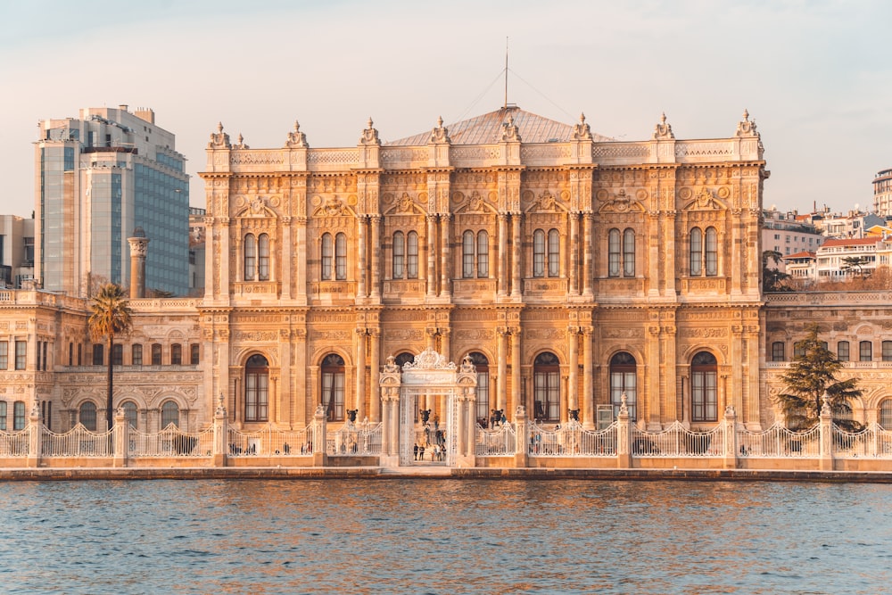 a large building sitting next to a body of water