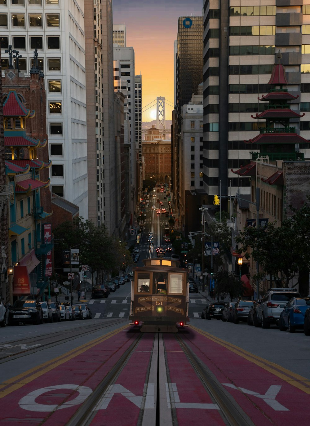 a train traveling through a city with tall buildings