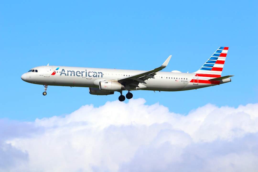 an american airlines plane flying in the sky, American Airlines A321 Landing