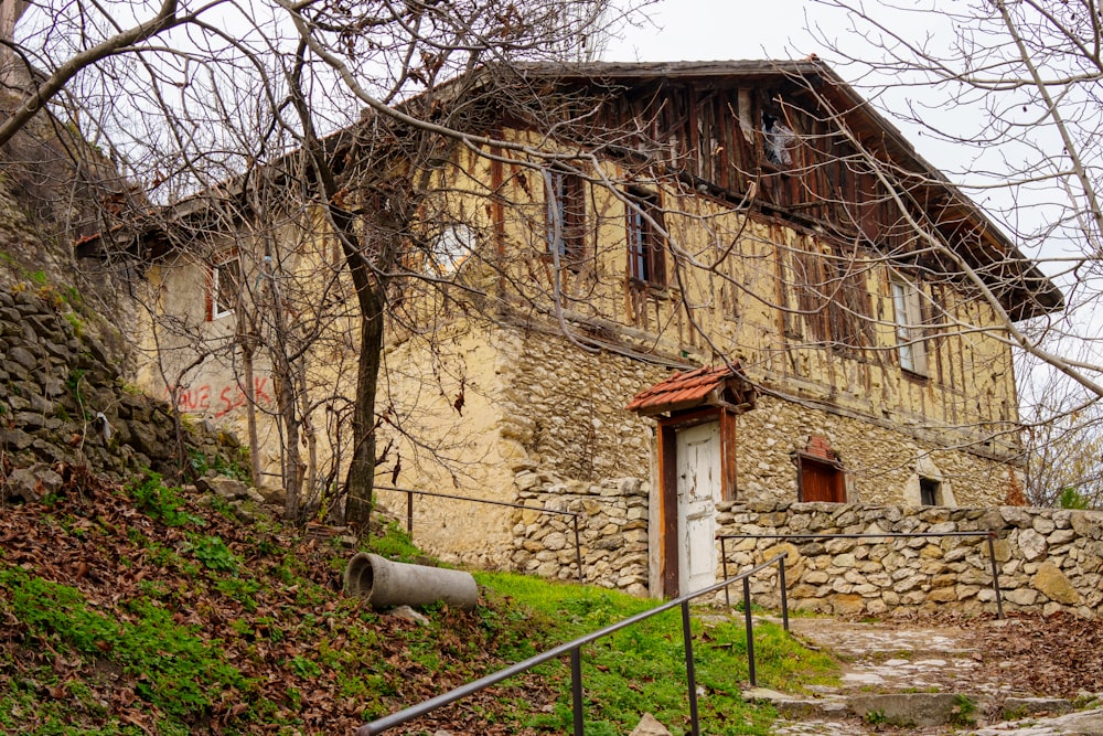 a stone building with a door and a window