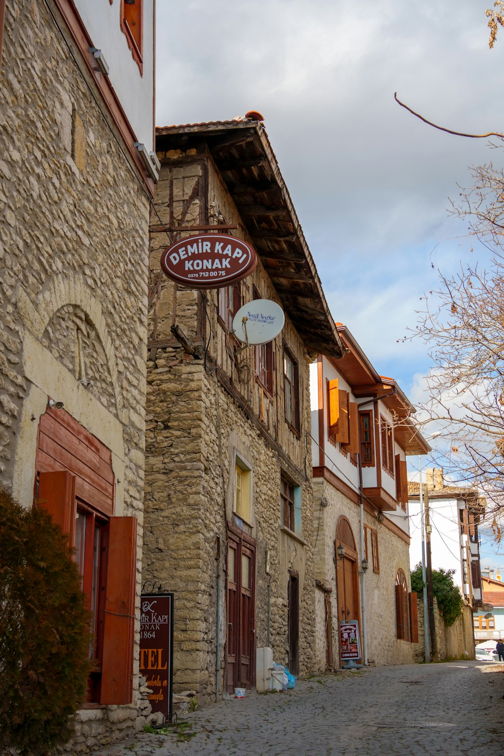 a stone building with a sign on the side of it