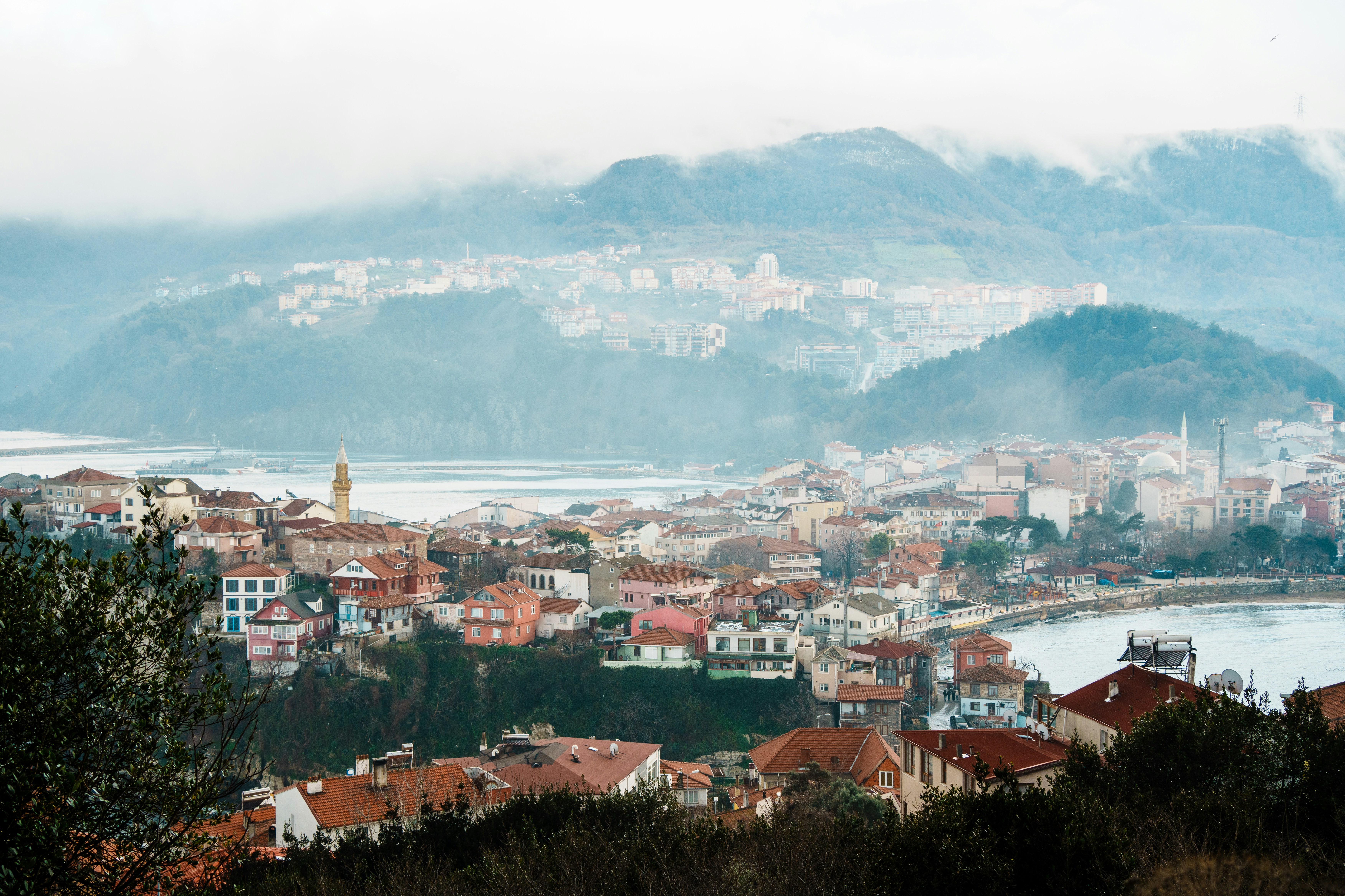 a view of a city with mountains in the background