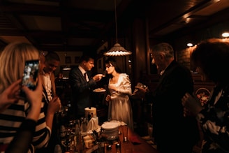 Guests happily filling out RSVP forms on their phones.