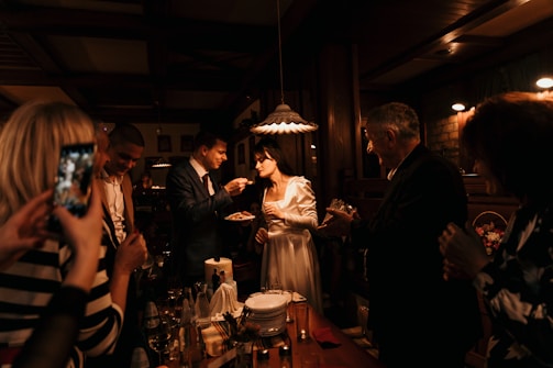 Guests happily filling out RSVP forms on their phones.