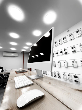 A sleek display of electronic devices stacked neatly in a modern warehouse setting.