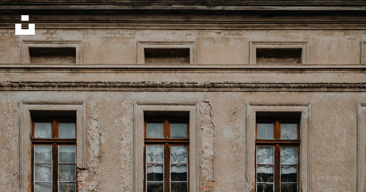 Clock Windows Building A building with windows and a clock on the side of it photo – Free ...