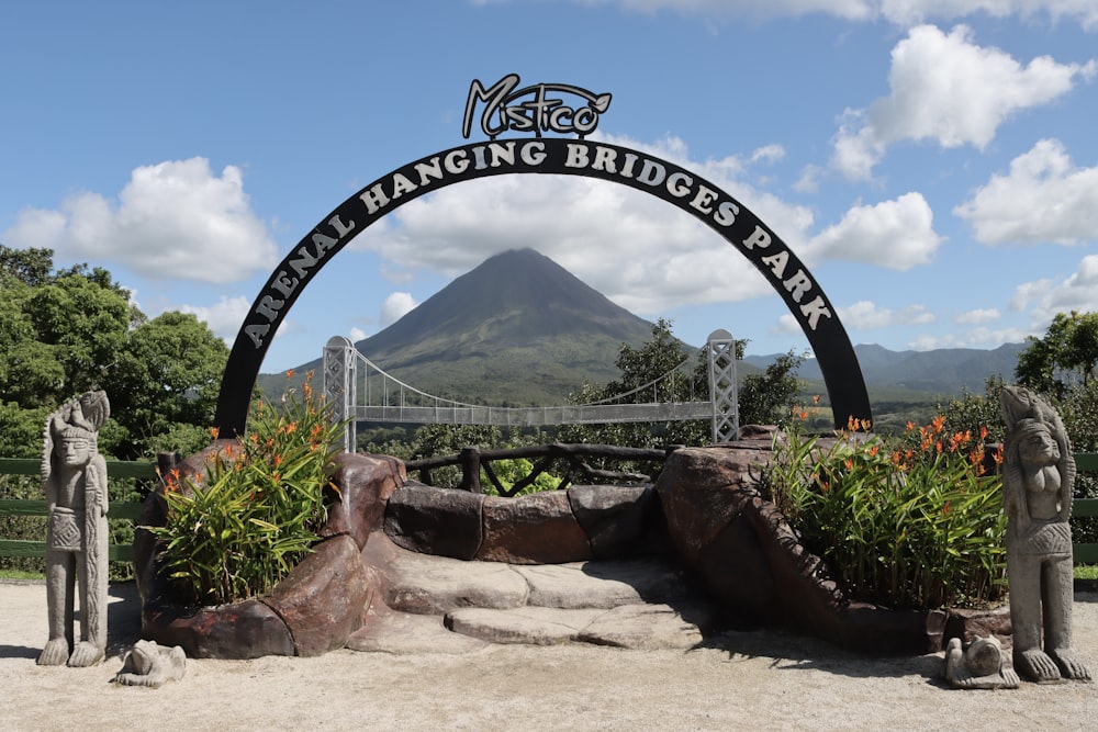 the entrance to the walking bridges park with a mountain in the background