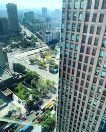 Aerial view of a busy urban area in Saudi Arabia with buildings and streets.
