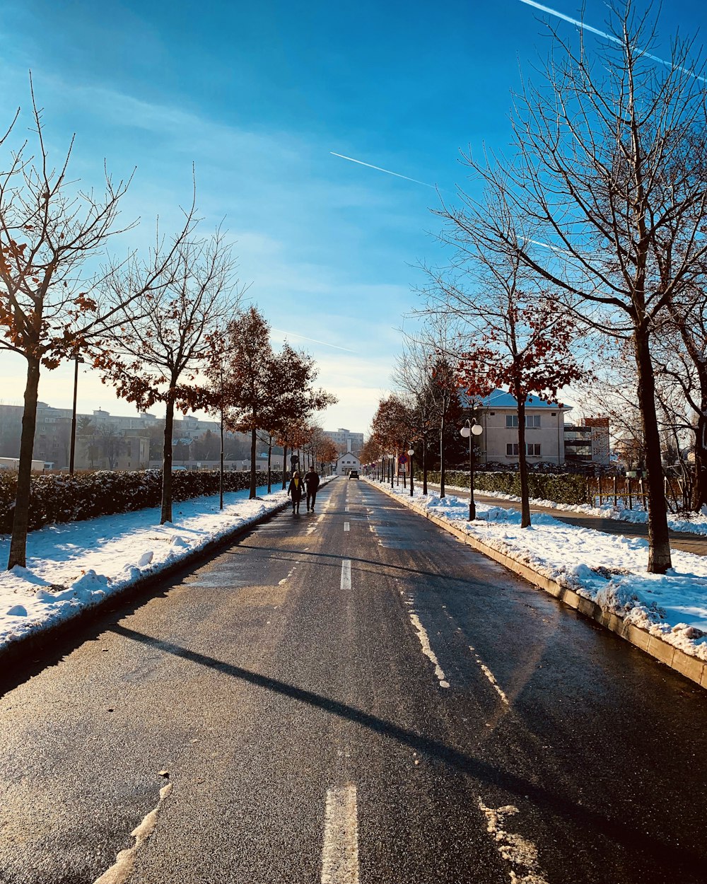 a street that has some snow on it