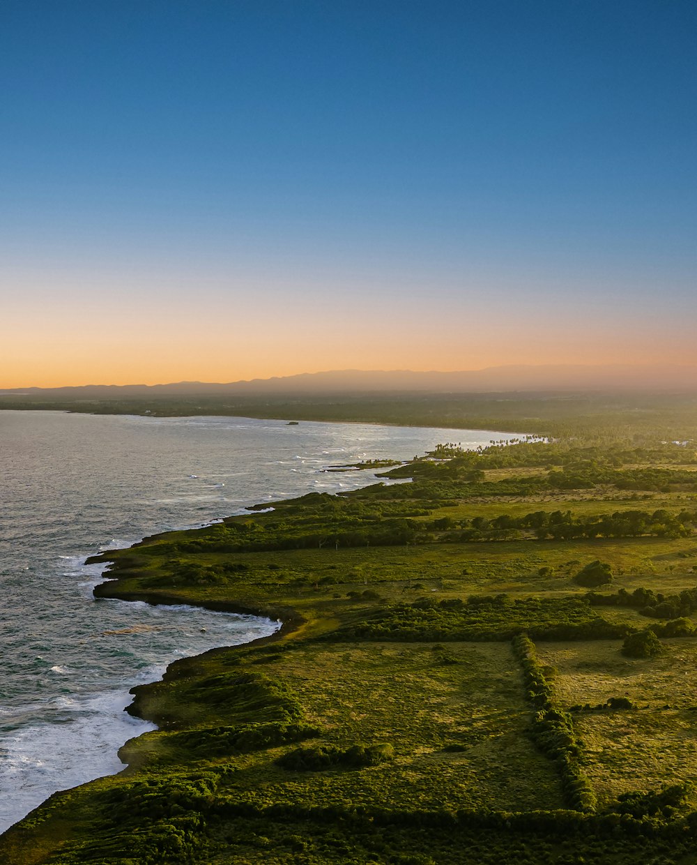 a scenic view of the ocean and land