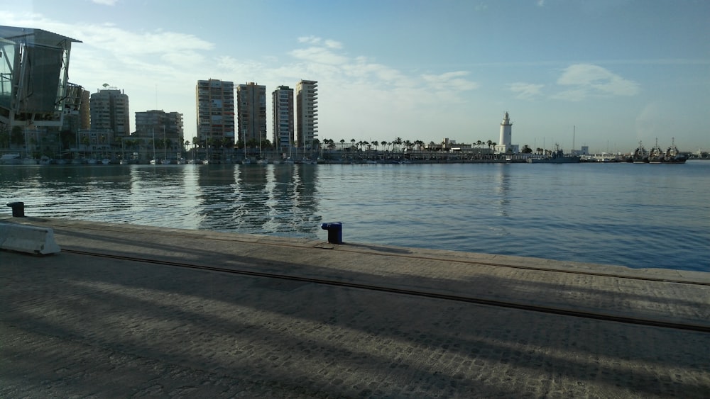 a body of water with a city in the background