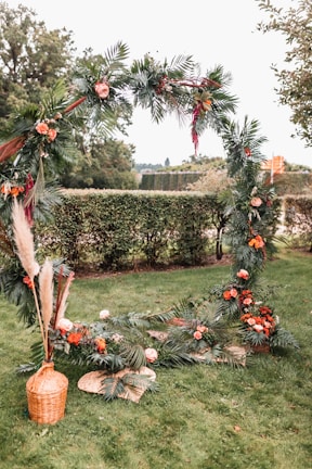 Close-up of a vibrant floral archway framing a wedding entrance