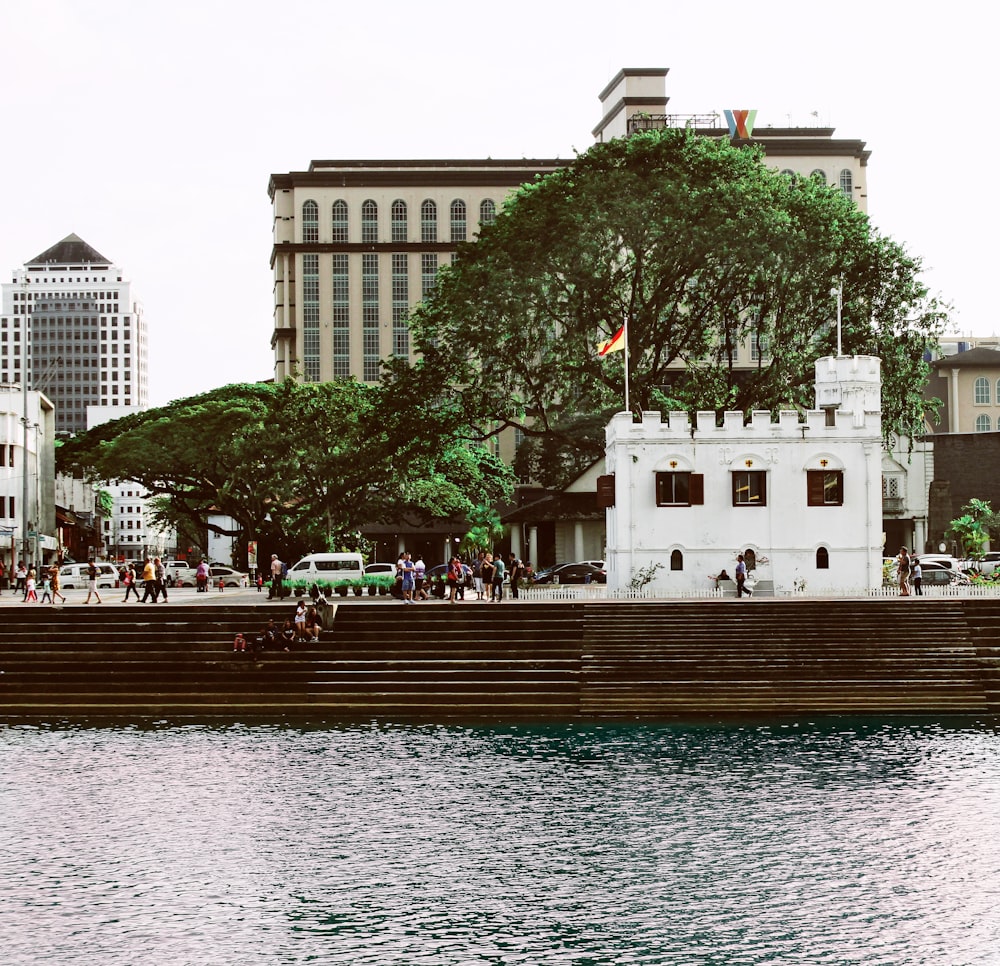 a large body of water with a building in the background