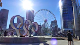 Group enjoying giant olympiads games outdoors in daylight.