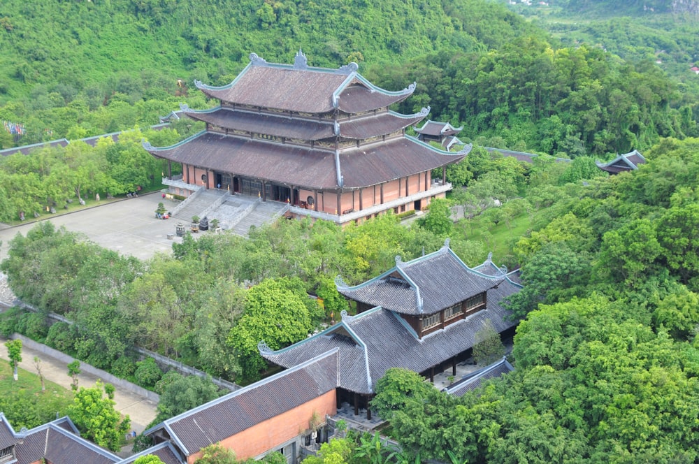 an aerial view of a building surrounded by trees