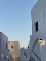 Elegant black and white image of a private villa terrace featuring minimalist design and soft lighting.