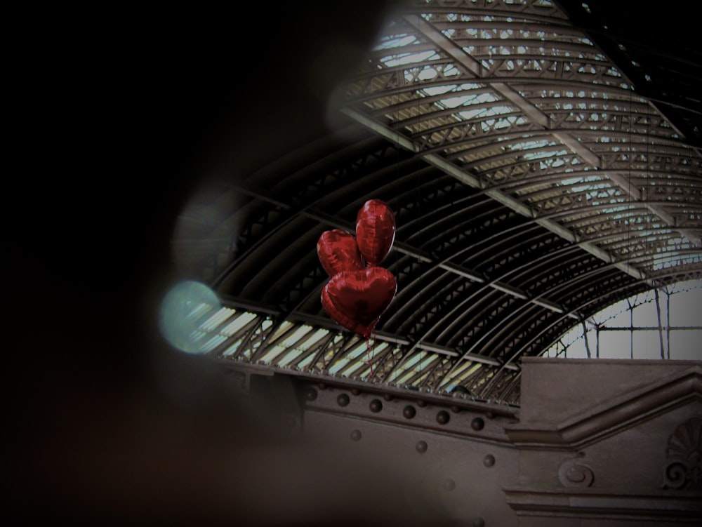 a sculpture of a heart on a railing