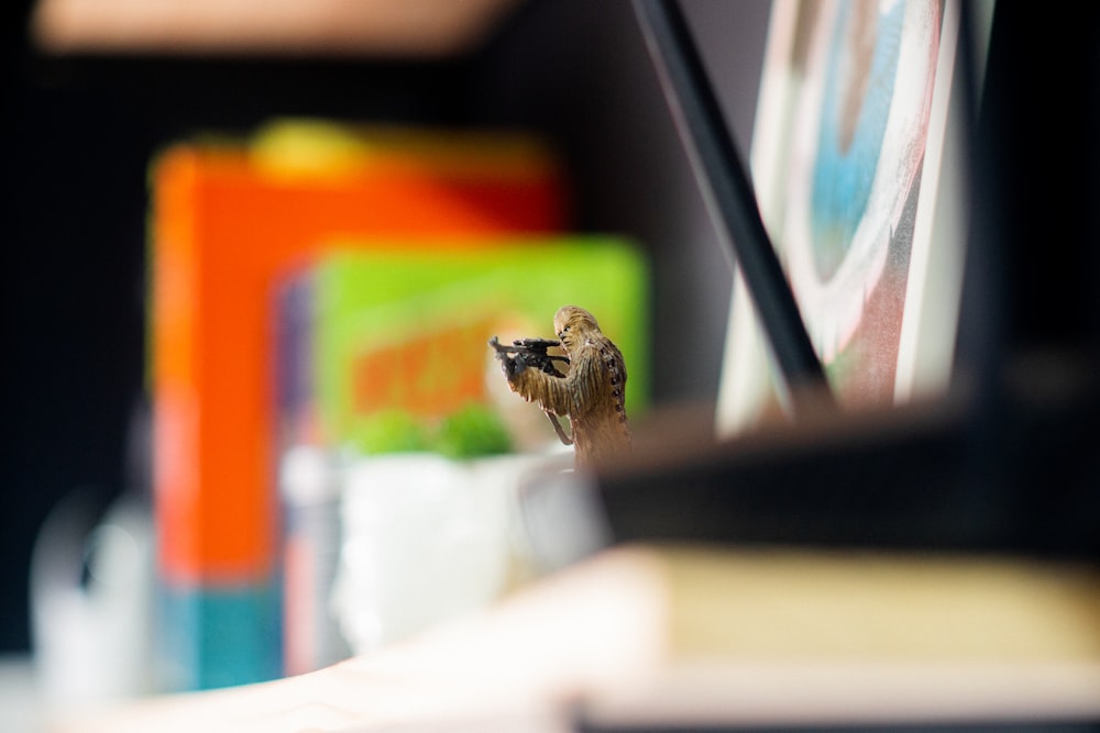 a bee sitting on top of a table next to books