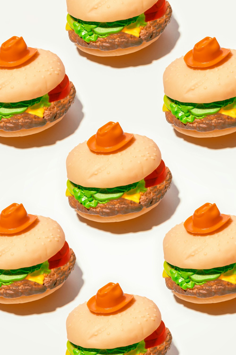 a close up of a hamburger on a white surface