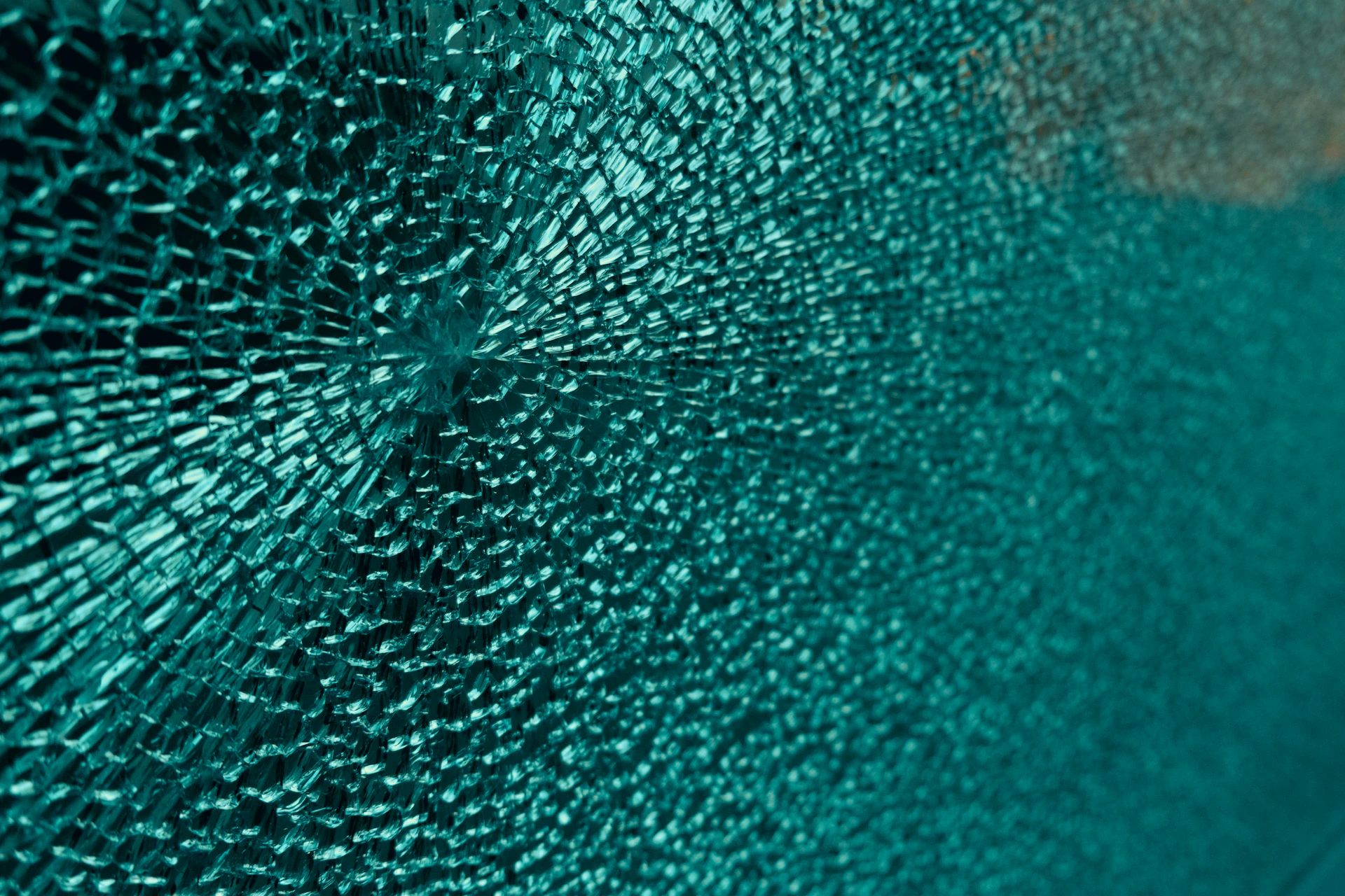a close up of a broken glass window