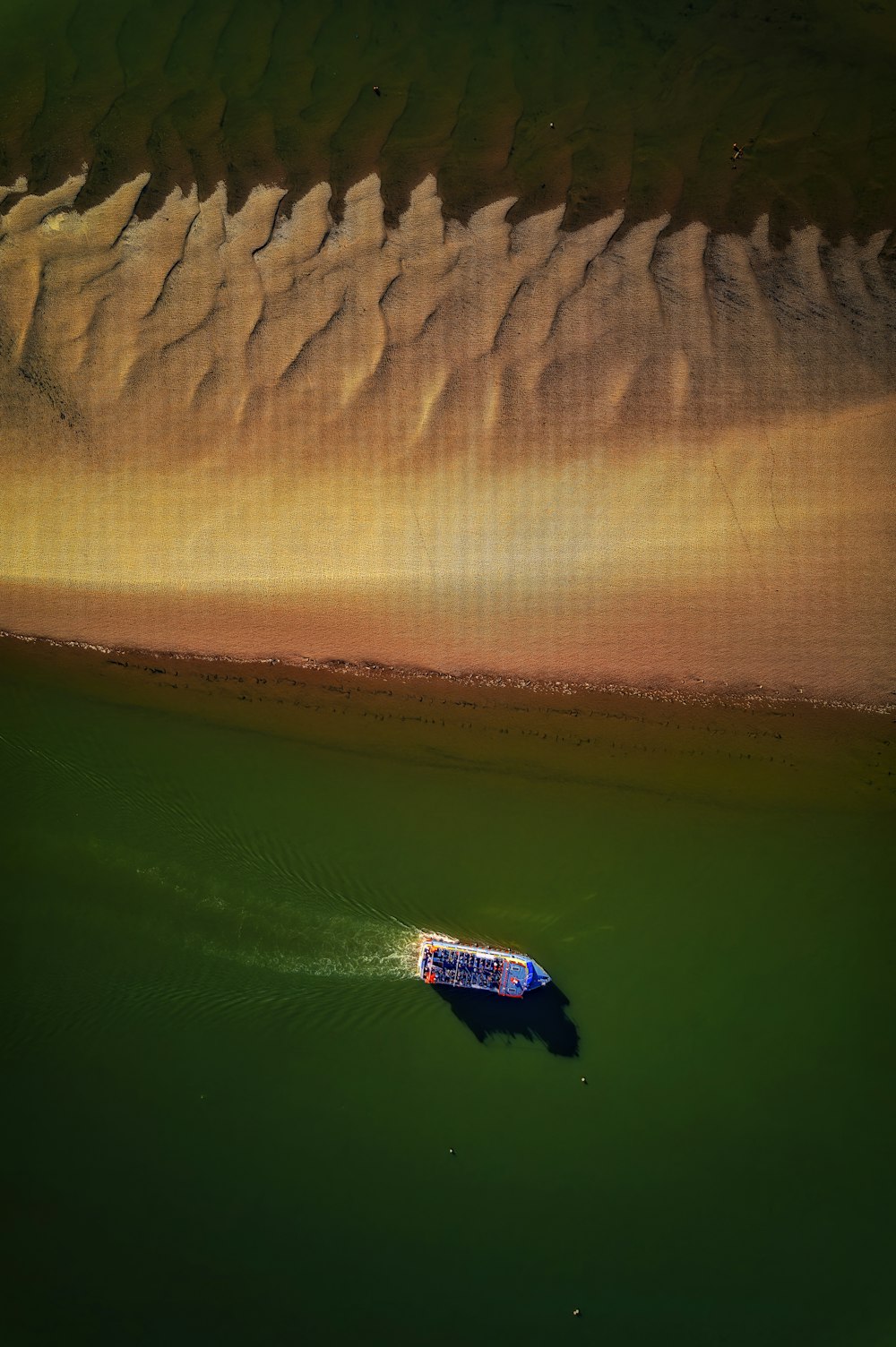 a boat floating on top of a body of water