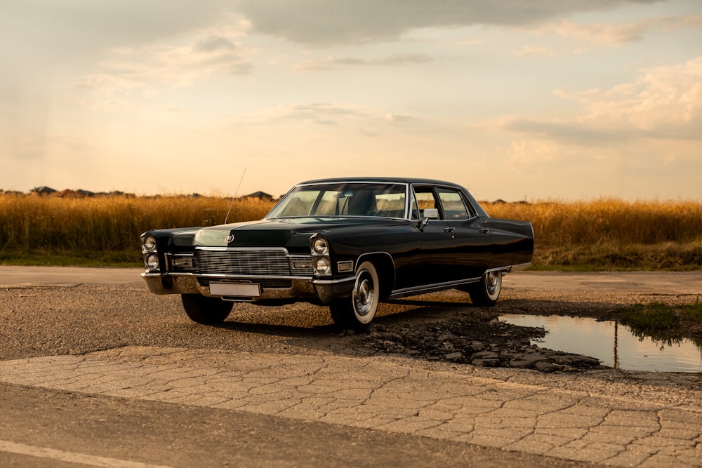 a black car parked on the side of the road