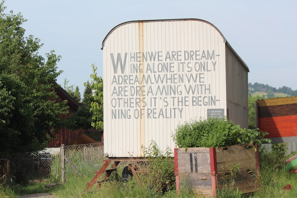 a large white building with a quote on it