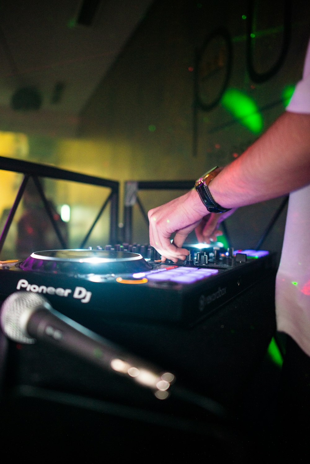 a dj mixing music on a turntable at a party
