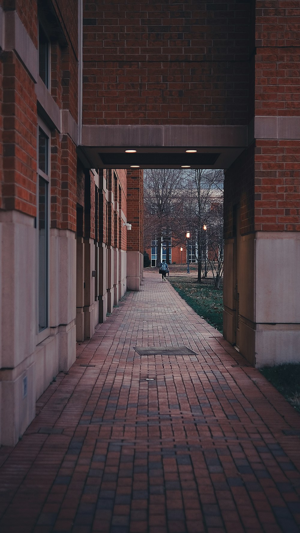 a brick walkway leading to a brick building