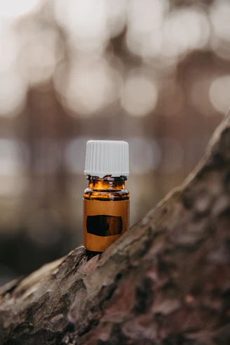 a bottle of medicine sitting on top of a tree