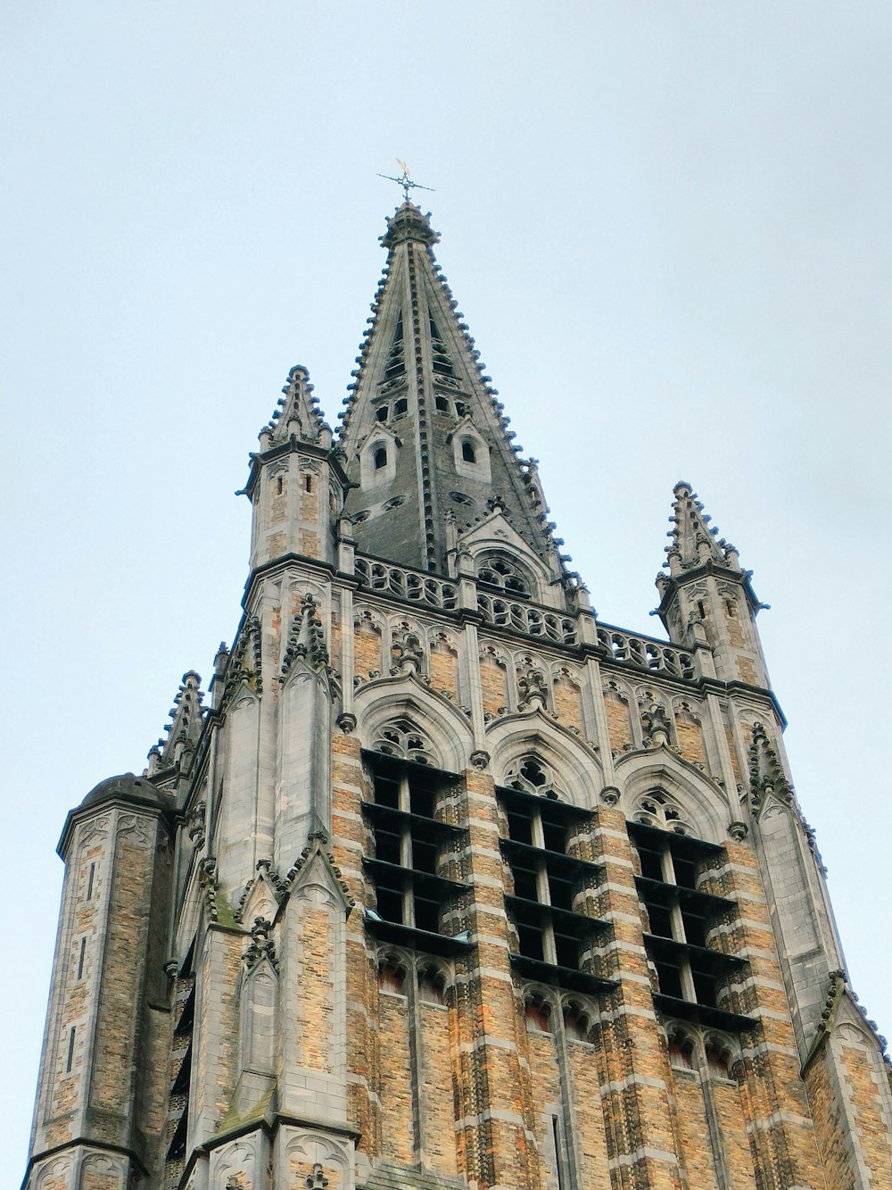 a very tall building with a clock on it's side