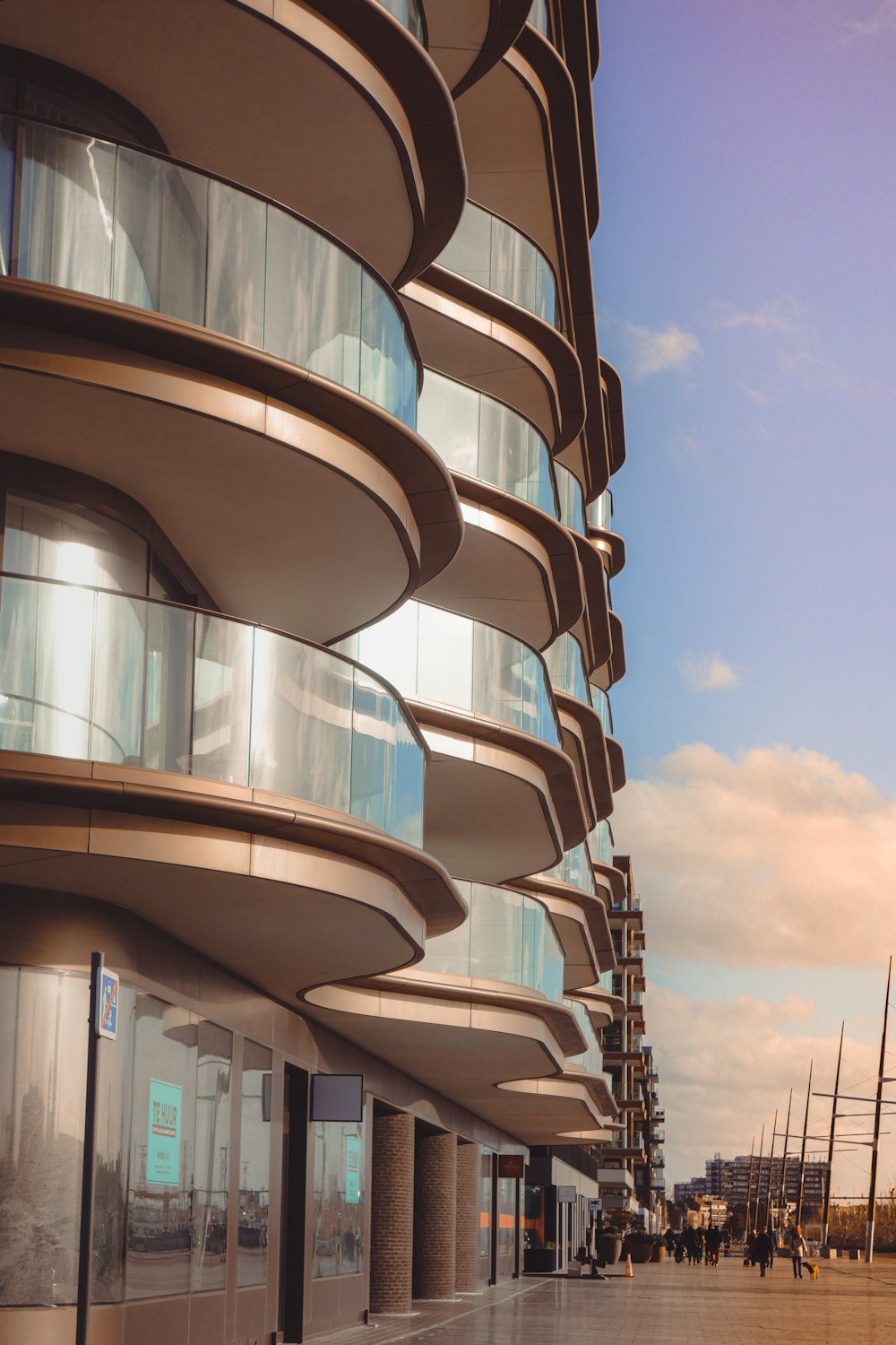 a tall building with many balconies next to it