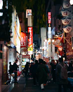 A vibrant city street glowing with neon signs and bustling with happy shoppers using coupons.