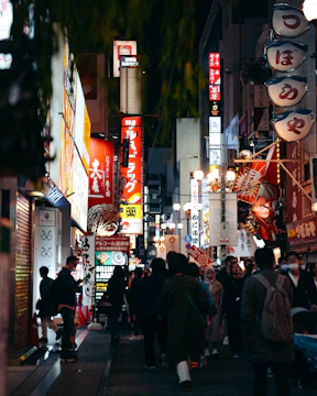A vibrant city street glowing with neon signs and bustling with happy shoppers using coupons.
