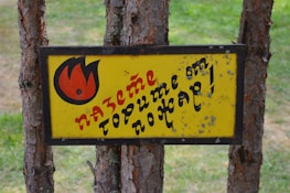 Vibrant yellow alert icon glowing on a navy blue background, symbolizing climate warnings.