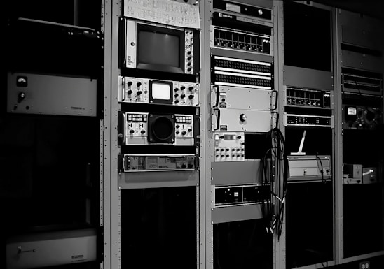 A modern media center showcasing broadcasting equipment and professionals at work.