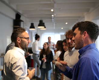 a group of people standing in a room