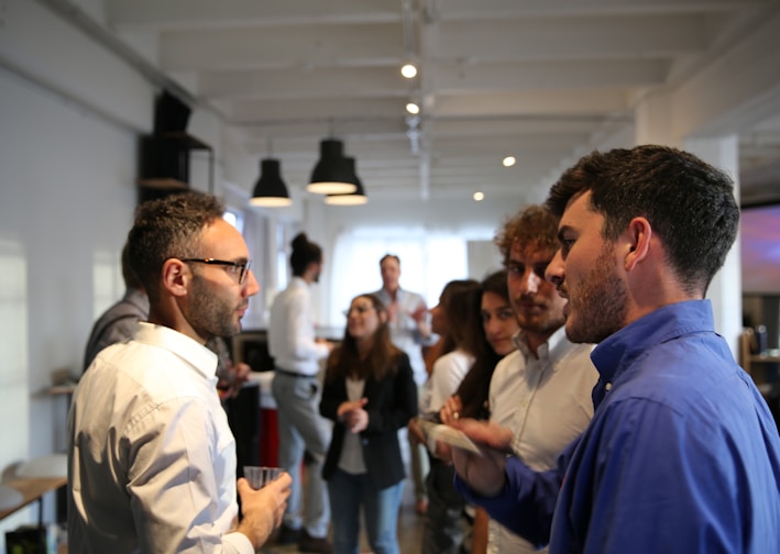 a group of people standing in a room