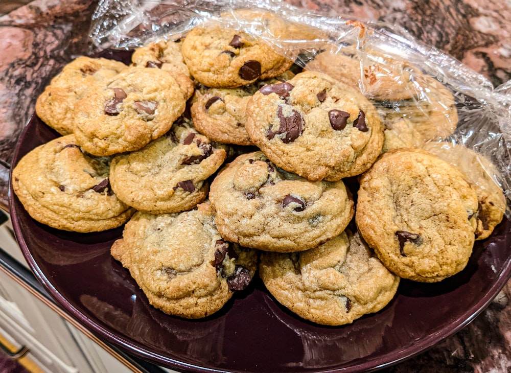 a plate of chocolate chip cookies on a table